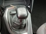 an image of a car ' s gear lever in the center console
