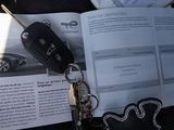 a car key sitting on top of a book next to a car key