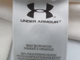 the label on a white t - shirt reads under armour, made in singapore