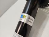a close up of a bicycle ' s front wheel with a sticker on it