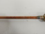 an image of a pencil with a wooden handle sitting on a white surface