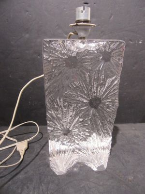 a lamp that is sitting on a table next to a cord