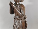 pair of carved wood figures of a woman kneeling and praying