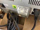 a close up view of a computer with a power cord plugged into it