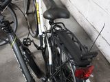 two bikes parked next to each other in a parking garage