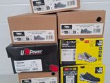 several boxes of shoes are stacked on top of each other
