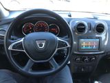 the interior of a car with a steering wheel and dashboard controls