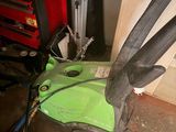 a green and black blower sitting on top of a table