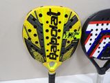 two tennis rackets that are next to each other