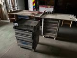 two work benches in a garage with a work table