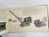 an open book with a drawing of a crane on it