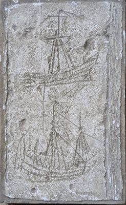a stone plaque with a drawing of a ship on it