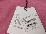 pink sweater with a price tag attached to it on a hanger