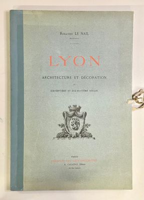 an old book sitting on top of a table next to a pair of scissors
