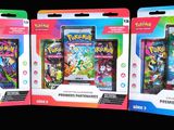 trois paquets de cartes Pokémon exposés les uns à côté des autres