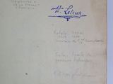an old book with writing on it sitting on a table