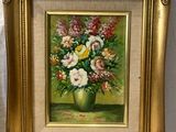 peinture d'un vase de fleurs dans un cadre doré sur fond blanc