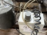 a pile of electrical equipment sitting on a pallet