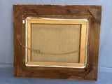 an old picture frame with a rope hanging from it ' s side