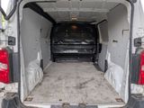 the back of a van with the door open and the back of the van with the door open
