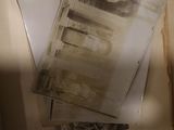 a book with old photos in it sitting on a table