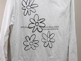 white long sleeved t - shirt with black and white flowers on it