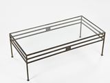 a glass coffee table with a metal frame and metal legs