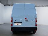 a white van that is parked in a room
