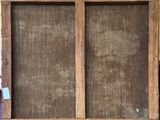 an old window with a wooden frame on the outside of it