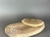 pair of natural stone heart shaped sculptures on grey background