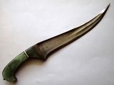a knife that is laying on a table