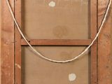 an old picture of a wooden frame with a rope hanging from it ' s side