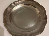 a silver plate that is sitting on a table
