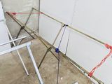 a metal frame with a red string attached to it