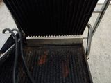 a grill that has a grill on top of it