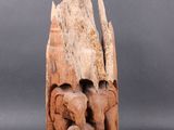 an elephant and calf carved into a piece of wood on a gray background