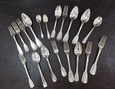 a lot of silver spoons and forks on the table