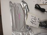 a bag of silver foil and a pair of scissors on a table