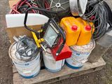 a pile of assorted electrical equipment on a pallet