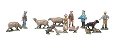 many figurines of people and animals in a row