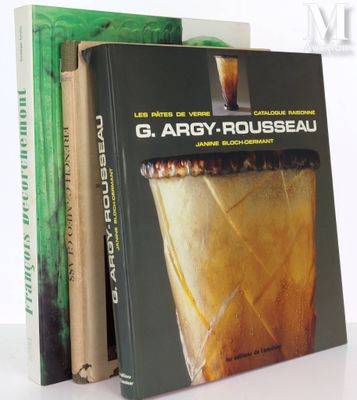 three books are stacked on top of each other on a table