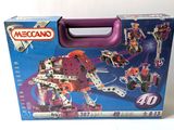 a box with a toy set in it on a white surface