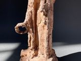 statue of a woman holding a bowl in her hands