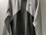 la veste coupe-vent The North Face