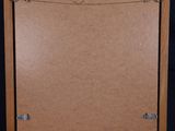 a wooden easel with a piece of paper on top of it
