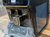 a coffee machine that is sitting on a wooden table