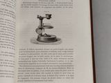 an open book with a picture of a microscope on it