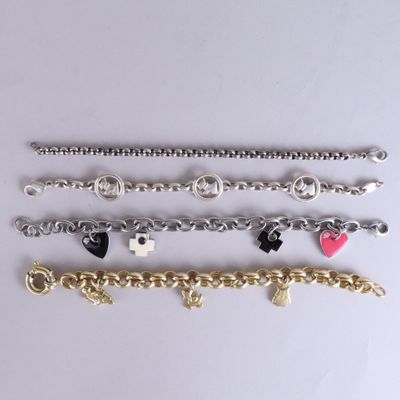 five different bracelets with charms and charms on them