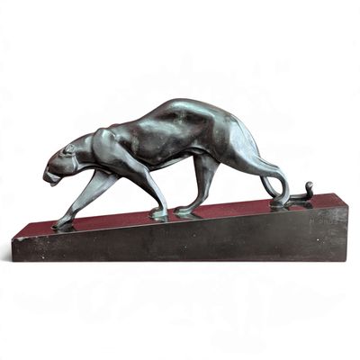 statue of a panther on a wooden base on a white background