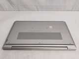 a laptop that is sitting on a white surface
